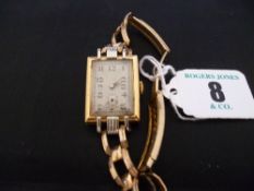 A lady`s eighteen carat gold encased oblong dial late Edwardian wristwatch, marked `Breget,