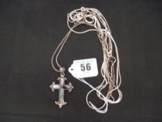 A small parcel of silver and white metal necklaces; and a white metal and abalone crucifix