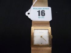 A gent`s nine carat gold encased square dial Sarcar Geneve wristwatch with wide incorporated nine