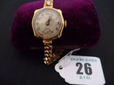 A lady`s Benson nine carat gold encased square dial wristwatch with triple row non-gold bracelet