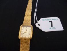 A lady`s Rotary near square dial yellow metal encased quartz wristwatch with incorporated bracelet
