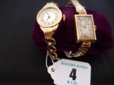 A lady`s oblong dial nine carat gold wristwatch with expanding yellow and white metal bracelet and a