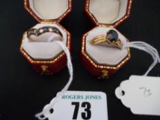 A nine carat gold amethyst and CZ wishbone ring; and a nine carat gold black stone dress ring with