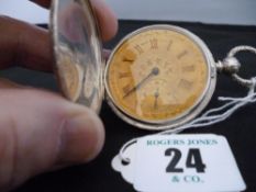 A silver encased Swiss made engine turned gent`s full hunter keywind pocket watch having a yellow