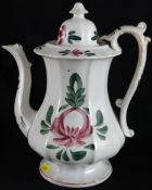 Llanelli Pottery; a turn of the Century hot water jug, hand painted in the ‘Persian Rose’ pattern,