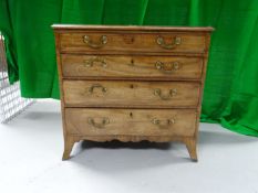 A George III mahogany chest of four equal drawers with splayed feet and brass swan neck handles,