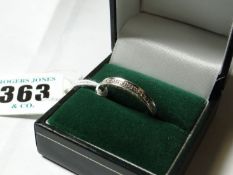 An eighteen carat white gold eternity ring.