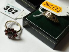 A nine carat gold amethyst and diamond dress ring and a nine carat gold garnet cluster dress ring.