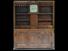 A rare late 17th / early 18th Century North Wales oak clock housekeeper’s dresser, the clock