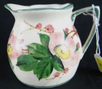 Llanelli Pottery; an early 20th Century milk jug hand decorated with painted wild dog roses and