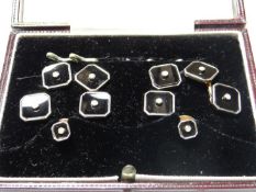 A cased ensemble of gold, onyx and seed pearl cufflinks and buttons.