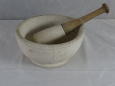 A large stoneware pestle and mortar, 10 ins diam.