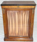 A late Victorian walnut single door credenza on a chamfered base plinth, 30 ins wide (77 cms).