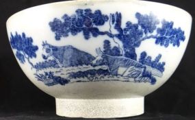 An early 19th Century blue and white transfer printed footed bowl decorated with recumbent cattle,