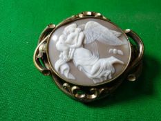 A classical angel, lady and child oval cameo in a scrolled and wavy frame.