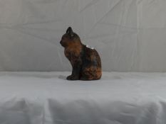 Ewenny Pottery; a circa 1900 seated cat with traces of black paint, having mark to inside base ‘Clay