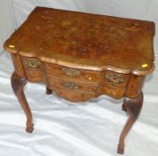 An 18th Century Dutch walnut and floral marquetry table having flower urn and bird decoration and