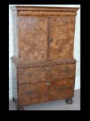 An 18th Century oyster veneered Kingwood cabinet on chest, the veneers near identical to Lot 50