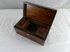 An oblong hardwood late 18th Century tea caddy with boxwood stringing and a good interior of outer