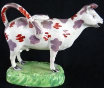 Swansea Cambrian Pottery  (1764-1870); a Swansea cow creamer complete with cover and looped tail,