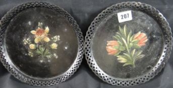 A pair of rare Pontypool Japan Ware trays with painted floral decoration, 21 cms diameter.
