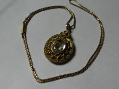A nine carat gold box link neck chain with an oval pinchbeck locket having a photo back and an
