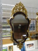 An 18th Century Venetian carved gilt wood mirror, the frame inset with amethyst cabochon glass,