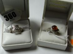A gent’s silver and amber dress ring and a silver Celtic style dress ring.