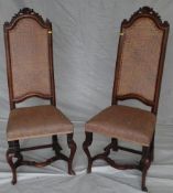 A pair of walnut framed high backed side chairs, late 17th/early 18th Century with woven cane