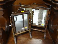 A Georgian mahogany swing toilet mirror with turned and baluster supports and scrolled feet and a