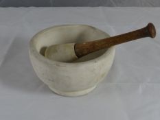 A small stoneware pestle and mortar, 7 ins diam.
