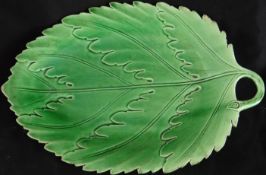 An early 19th Century green glazed leaf handled dish, unmarked but having impressed star (similar