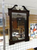 A late 19th Century mahogany framed wall mirror with fretwork and broken swan neck, 42 ins high (107