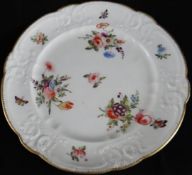 Nantgarw Porcelain; a fine scroll moulded plate painted finely with sprays of flowers and having