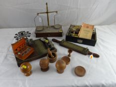 A set of apothecary’s scales, an old pharmaceutical tablet counter, a cased Overbecks rejuvenator,