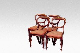 A set of four Victorian mahogany balloon back dining chairs.