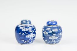 A pair of late 19th Century Oriental blue prunus blossom lidded ginger jars with original corks, 5.5