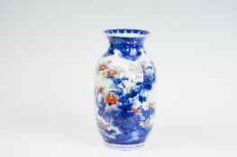 A 19th Century Oriental baluster vase decorated blue and orange blossom, 12.75 ins (33 cms) high (