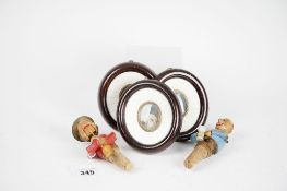 Three framed classical style 20th Century miniatures; and two novelty wooden wine bottle stoppers.