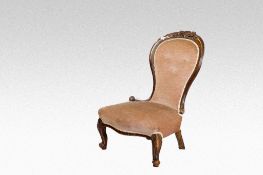 A Victorian mahogany buttoned, Dralon and spoonback lady`s armchair on cabriole and knurled