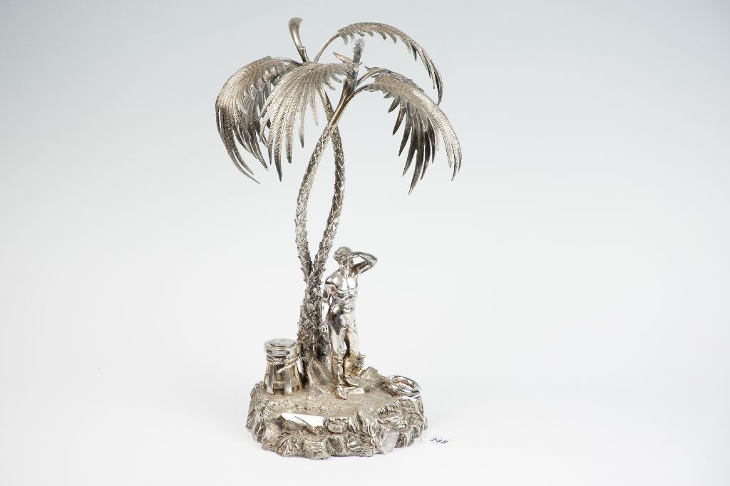 A Mappin & Webb electroplated `Treasure Island` table centrepiece having a naturalistic base with