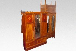 An Edwardian mahogany and inlaid mirror front wardrobe, and a washstand with replaced top; and an