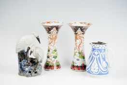 A pair of late 19th Century wide necked Imari baluster vases with floral and blossom decoration (