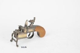 A Dunhill tinder pistol lighter, Patent Number 592139.