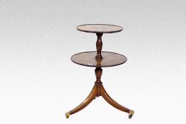A double shelf mahogany graduated waiter having a centre pedestal and three gently curved supports