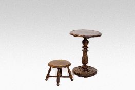 A polished circular topped occasional table with carved column and circular base; and a small