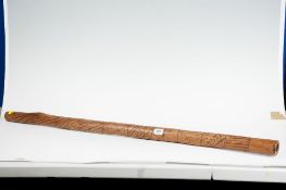 An Aboriginal didgeridoo with linework decoration, 42 ins (107 cms) long (Provenance; see Lot 317