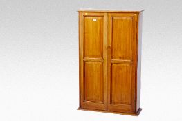 A quality mahogany two door cupboard having interior shelves and pigeon holes, 30 ins (76 cms) wide,