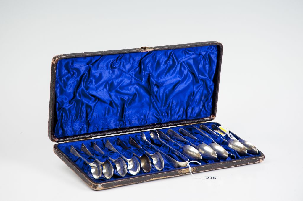 A cased set of twelve silver teaspoons, 10 ozs, Sheffield 1893; and a pair of similar period sugar