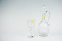 A Victorian narrow necked decanter with ridged decoration; and a vine leaf etched wine goblet.